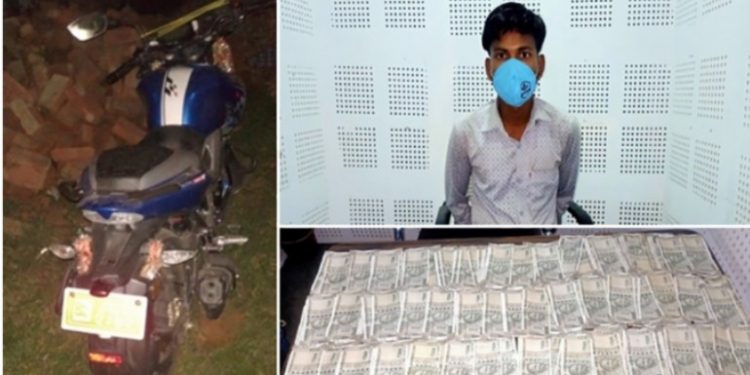 पर्सामा भारतीय नोटसहित एक युवक प क्रा उ
